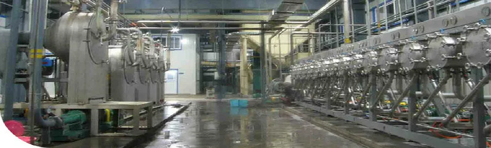 Process hall with stainless-steel tanks and filter presses